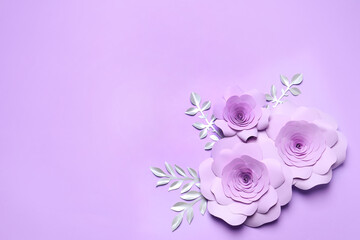 Beautiful flowers and branches made of paper on violet background, flat lay. Space for text