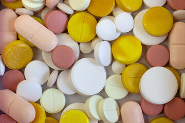 Fototapeta na wymiar Group of colorful pills as nice bright textured background Narrow focus line, shallow depth of field