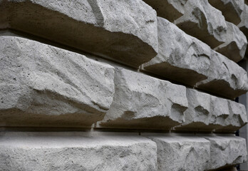 walls of the house from the 19th century formed by massive blocks of plaster bosses as...