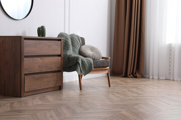 Modern living room with parquet flooring and stylish furniture