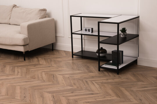 Modern living room with parquet flooring and stylish furniture