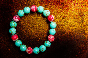 image of stone bracelet gold background
