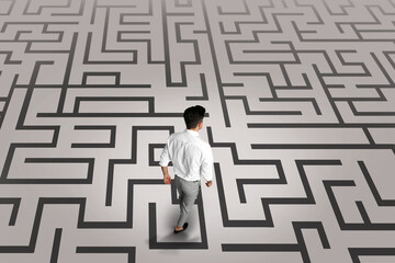 Thoughtful businessman and illustration of maze on light background