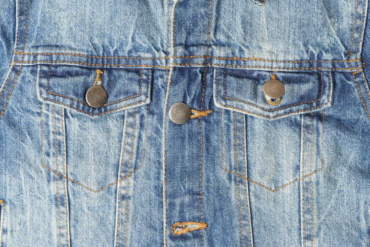 blue denim jacket with two pockets, close up