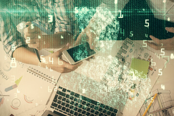 Double exposure of data theme hologram drawing and man and woman working together holding and using...
