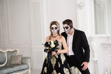 Portrait of a beautiful couple in medieval costumes with vampire