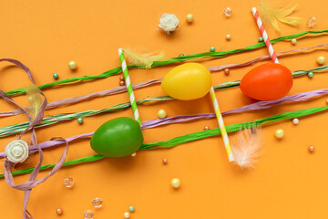 Musical notes make from Easter eggs on yellow background. Easter celebration concept. Top view