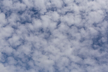 white puffy clouds in a blue sky