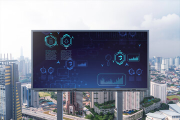 Technology hologram on billboard over panorama city view of Kuala Lumpur. KL is the largest tech hub in Malaysia, Asia. The concept of developing coding and high-tech science.