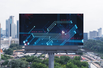 Technology hologram on billboard over panorama city view of Kuala Lumpur. KL is the largest tech...