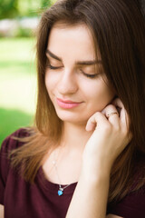 Attractive young woman enjoying her time outside in the park.