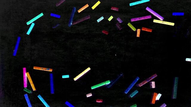 the word ART with multi-color chalk on a blackboard stop motion 