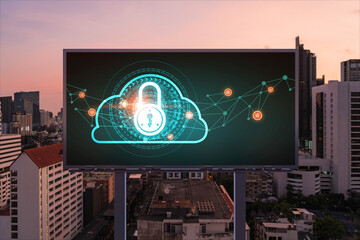 Padlock icon hologram on road billboard over panorama city view of Bangkok at night to protect business, Southeast Asia. The concept of information security shields.