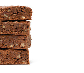 stack of baked chocolate brownie pieces with walnut isolated on white background, delicious dessert