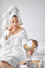 Obraz na płótnie Canvas charming lady in bathrobe and towel relax, enjoy self-care, beauty procedures