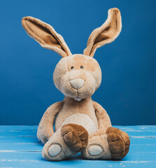 funny beige plush rabbit with big ears and funny face