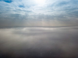Aerial high view. Flying over the clouds.