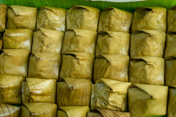 Thai desserts wrapped in banana leaves