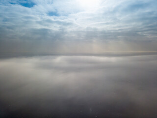 Aerial high view. Flying over the clouds.