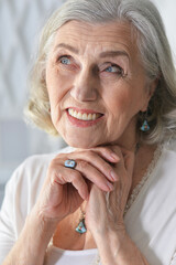 portrait of beautiful senior woman posing  at home