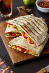 Quesadilla with chicken, tomatoes, corn, cheese and chilli. Mexican food. Fast food.