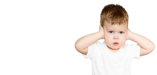 little 3-years child closing ears with hands frightened emotion isolated on white with copy space 