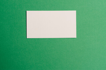 business cards on a green background office desk finance