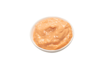 Sauce in a bowl isolated on white.