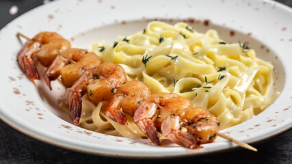 fettuccine pasta with Prawns or Shrimps, lemon and garlic, Italian pasta fettuccine. Italian food, top view. Food recipe background. Close up