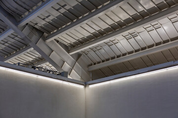 Metal beams and heavy steel piles as part of strengthening and supporting the roof of a building