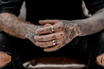 Close up of professional tattooer artist. Tattoo art on body. Equipment for making tattoo art. Master makes tattooed in studio.