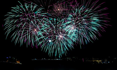 Full moon and fireworks lighting up the night sky