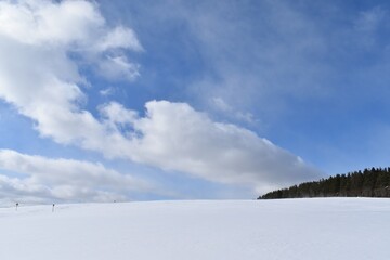 A field in winter under a blue sky, Québec