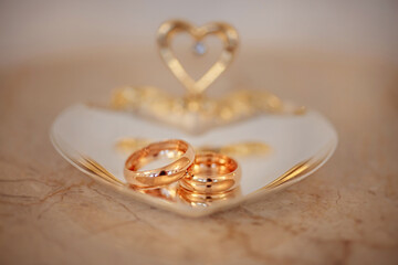 Two wedding engagement rings on a beautiful plate