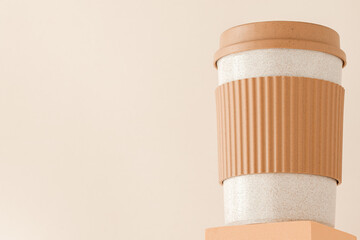 Reusable cup, biodegradable travel plastic coffee mug on platform showcase. Bamboo eco friendly cup...