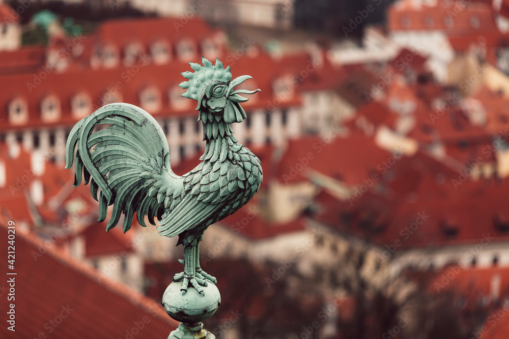 Sticker bronze weathercock in prague city