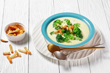 cream soup with broccoli and croutons in a bowl