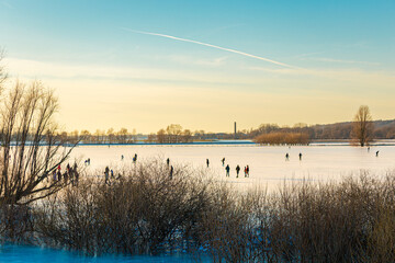 Ice skating on frozen floodplains in the Netherlands