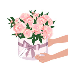 Hands hold flowers in a round box