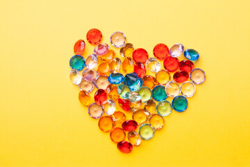 colorful diamond jewelry heart gift holiday yellow background