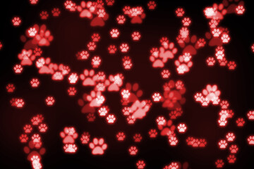 Black background with red glowing bokeh paws. Animal care concept.