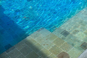 Fototapeta na wymiar swimming pool water in swimming pool and poolside high angle view