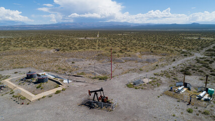 Oil Battery Gathering & Distribution System. Gas oil distribution station with cisterns on a yellow...