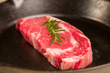 Red meat steak in a cast iron pan