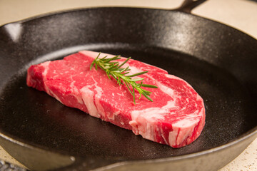 Red meat steak in a cast iron pan