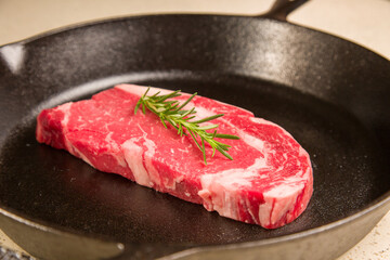 Red meat steak in a cast iron pan