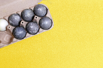 Eggs with marble stone effect painted with natural dye carcade flower on grey sparkling background