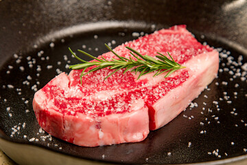 Red meat kosher organic steak in a cast iron skillet potatoes