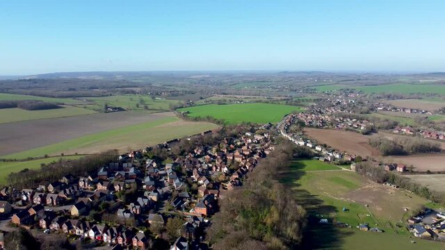 Drone shot flying over a housing estate in the village of Chartham in Kent. This is the St. Augustines area of Chartham, Kent, UK