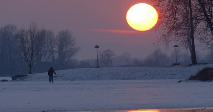 Sunset on the frozen Soderica lake, Croatia